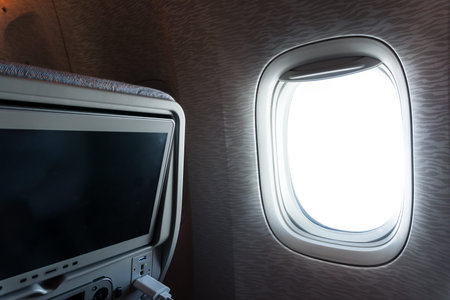 View on airplane window inside plane interior. Nobody