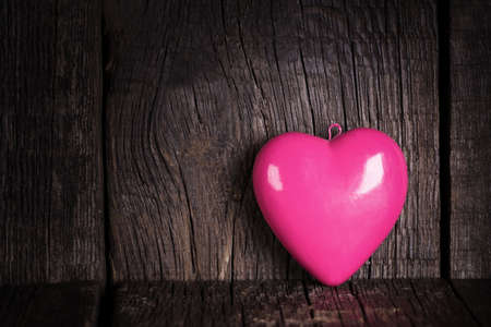 Heart shapes on rustic wooden backgroundの写真素材