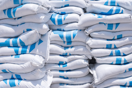 Stacks of cement bags, closeup. Outdoors on  construction siteの写真素材