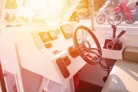 Control panel with wheel on speedboat, closeup. Nobodyの写真素材