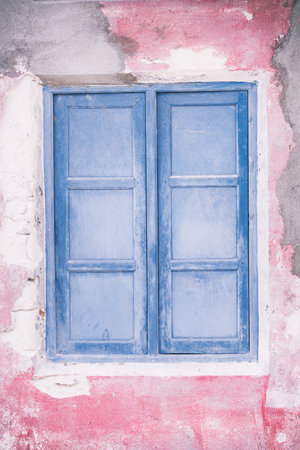 Old wooden closed window on maldivian house, nobody