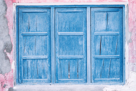Old wooden closed window on maldivian house, nobody