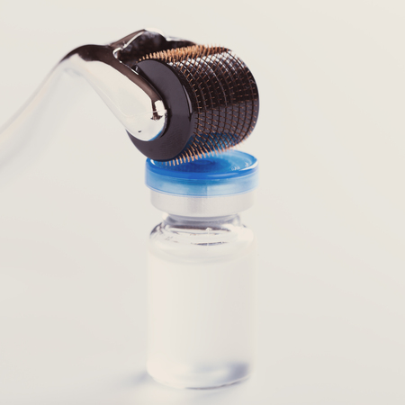 Derma Roller on white, microneedle mesotherapy for skincare, rejuvenating treatment concept.の写真素材