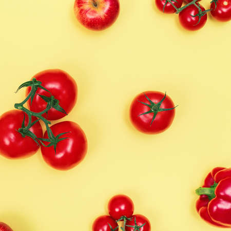 Top view composition of red vegetables and fruits on color background, flat layの写真素材