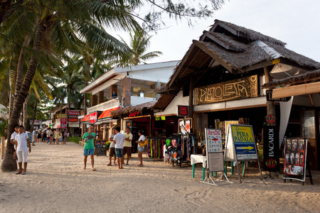 Philippines, Boracay Island - 21 May 2013: Local shops and bars on restaurant-lined white beachのeditorial素材