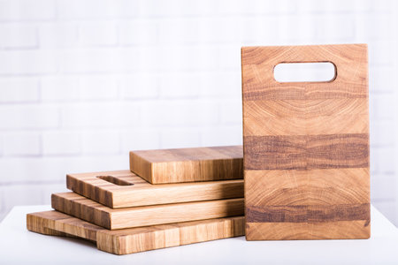 Wooden cutting boards closeup on brick backgroundの写真素材