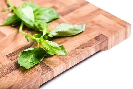 Wooden cutting board closeup on white backgroundの写真素材