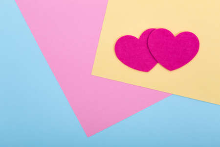 Heart shapes on serenity colored paper texture, flat layの写真素材
