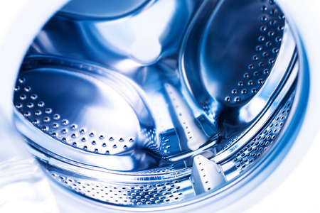 Detail of washing machine at bathroom, stainless drum inside, closeup, nobodyの写真素材