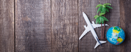 Travel objects on rustic wooden background. Top viewの写真素材