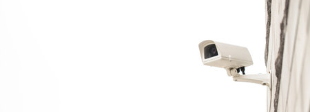 Surveillance camera on wall, outdoors. Video observation at modern house