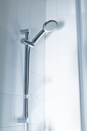 Shower head in white bathroom interior, nobodyの写真素材