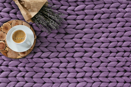 Autumn season concept of cozy home, hot coffee on merino plaid, top view, copyspaceの写真素材