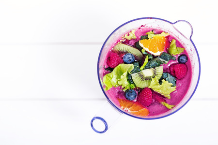 Top view of blending fruits ingredients for smoothie in blender, macro with copy spaceの写真素材
