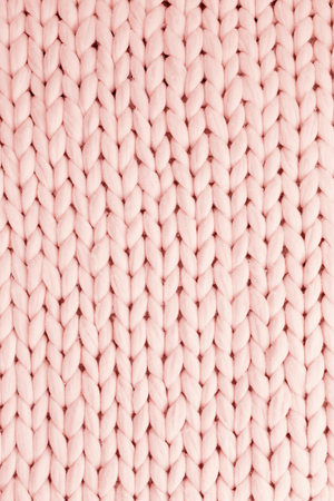 White texture background from merino knitted blanket, scandinavian minimalism backdrop with copy space, top viewの写真素材