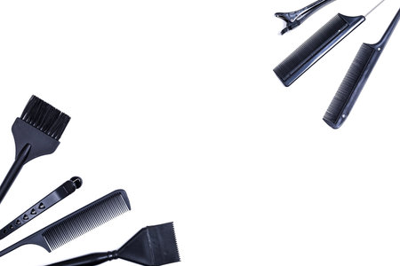 Hairdressing tools with copy space, combs and bleach brushes on white background, top view and flat layの写真素材
