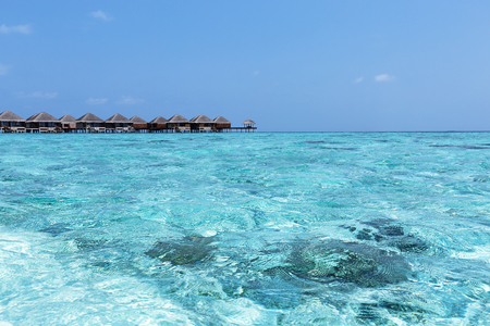 Tropical pristine beach with water bungalows at maldivian islandのeditorial素材