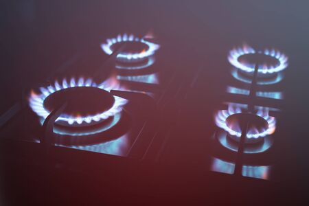 Kitchen burner flaming in the dark, closeupの写真素材