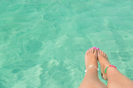 Catamaran boat sailing in Caribbean sea, view from motor yacht on ltan legs and blue water. Maritime...