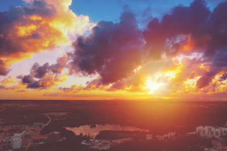 Aerial view from top on sunset above tropical town, travel destination. Summer vacation