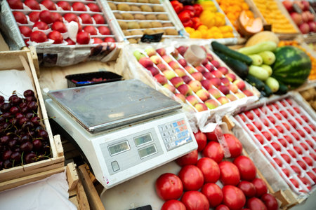 Scales at farms market, selective focus. Checking weight of food. Nobody