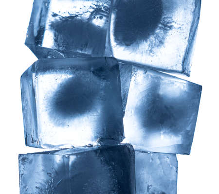 Ice cubes closeup on white background. Icecubes in glass. Macro shot. Blue toneの写真素材