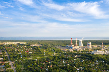 Smoking cooling pipes at power plant. Aerial view from copter