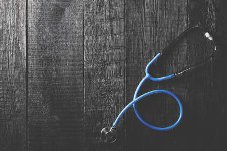 Stethoscope on wooden background. Medicine concept. Nobodyの写真素材