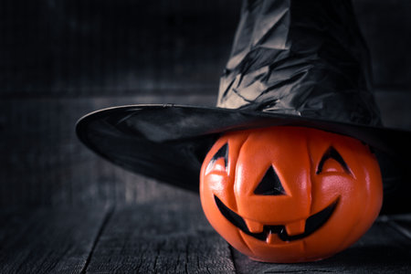 Halloween pumpkin on wooden background. Autumn background
