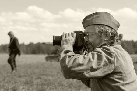 SAINT-PETERSBURG / RUSSIA - AUGUST, 22, 2020: Historical re-enactment of the battlefield of times World War II. Re-enactors dressed in uniform, military reconstruction, black and white imageのeditorial素材