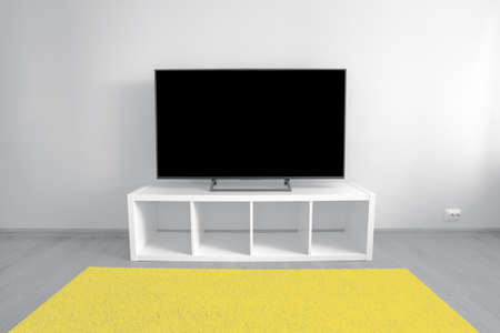 Lcd tv on white shef at modern room interior with nobody. Trendy colors of 2021 - Ultimate Gray and Illuminatingの写真素材