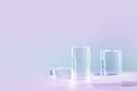 Acrylic empty podium for product presentation on pastel colored background, transparent geometric pedestalsの写真素材