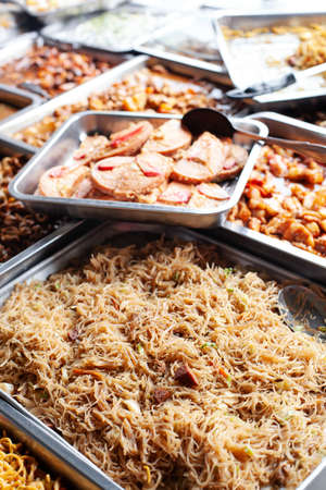 Asian street food. Traditional outdoor buffet with takeaway mealsの写真素材