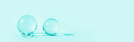 Astract backdrop with glass spheres on mint pastel color background with sun reflections,...