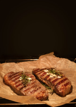 Cooking beef steaks inside oven. closeup