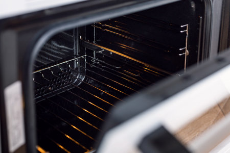 Opened electric oven with details inside, nobodyの写真素材