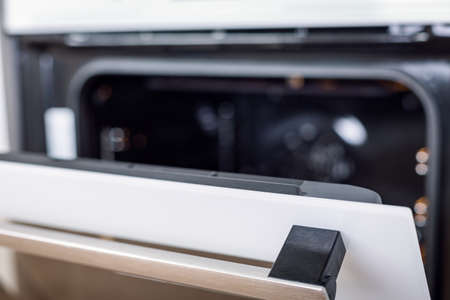 Opened electric oven in kitchen interior, nobodyの写真素材