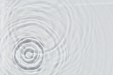Abstract water texture, surface with drops, rings and ripple. Flat lay, top view, background with copy spaceの写真素材