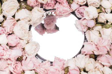 Trendy floral visual background with mirrors reflection and flowers, focus on mirror frame, copy spaceの写真素材
