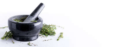 Bunch of fresh herbs in gray stone mortar, rosemary and thyme spices for aromatic culinaryの写真素材