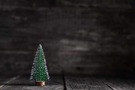 Spruce tree on wooden rustic background. New Year celebration. Winter holidaysの写真素材