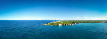 Macao beach with sandy coastline, turquoise water and stone cliff. Famous seashore for surfing in...