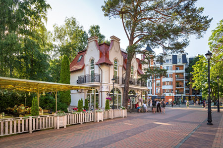 SVETLOGORSK, RUSSIA - July 7th, 2021: Central Rauschen square in resort town with stylized buildings, restaurants, cafes and gifts shops.のeditorial素材