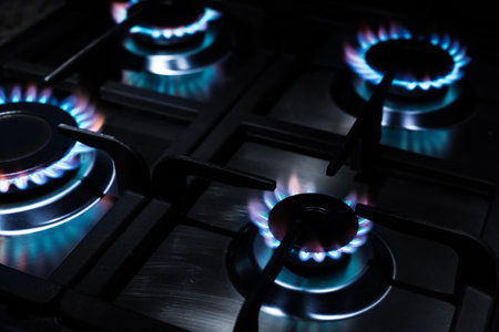 Gas oven flaming in the dark, closeupの写真素材