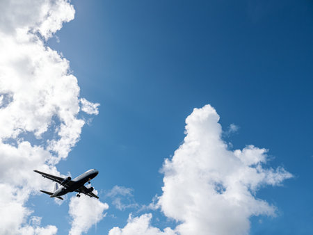 Airplane on sky and clouds background. Travel and transport conceptの写真素材