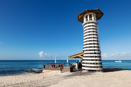 Lighthouse on Dominicus beach with Caribbean sea waves. Morning in la Romana. travel destination background cardの写真素材