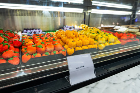 Variety of turkish colorful marzipan fruit forms, assorti desserts on sale. Focus on sweet products.の写真素材