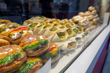 Fast food and snacks on sale at restaurants and cafes inside Istanbul Airport's terminal mall. selective focus on burgerの写真素材