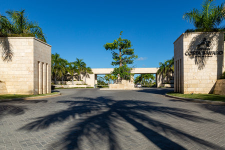 PUNTA CANA, DOMINICAN REPUBLIC - January 27, 2022: Entrance facade of Lopesan Costa Bavaro in Punta Cana. Resort, Spa and Casino. Traditional luxury caribbean gate and fence, decorated coconut palmsのeditorial素材
