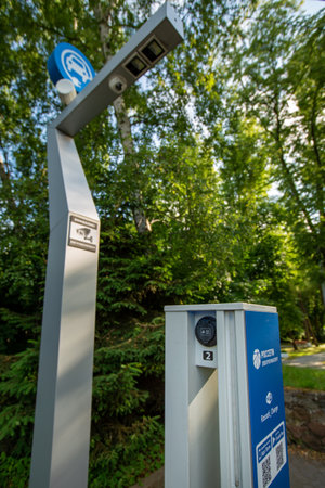YANTARNY, RUSSIA - JUNE 27, 2021: Electric car charging in nature, electrofilling stations (EZS) for electric vehicles, ecology conceptのeditorial素材